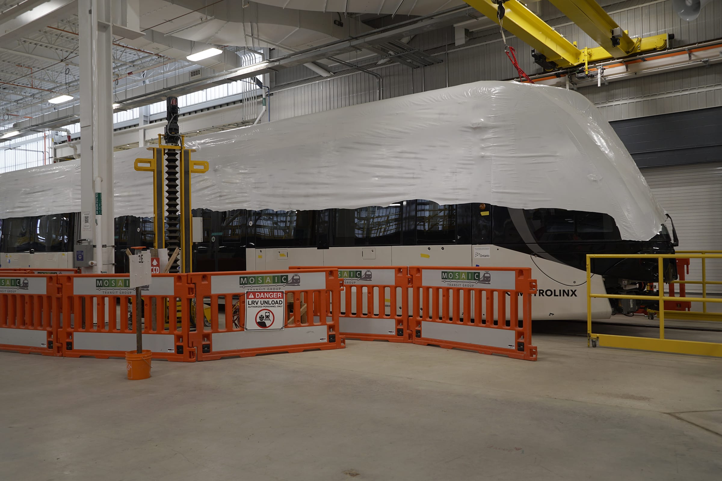 A LRV is shown inside the assembly plant.