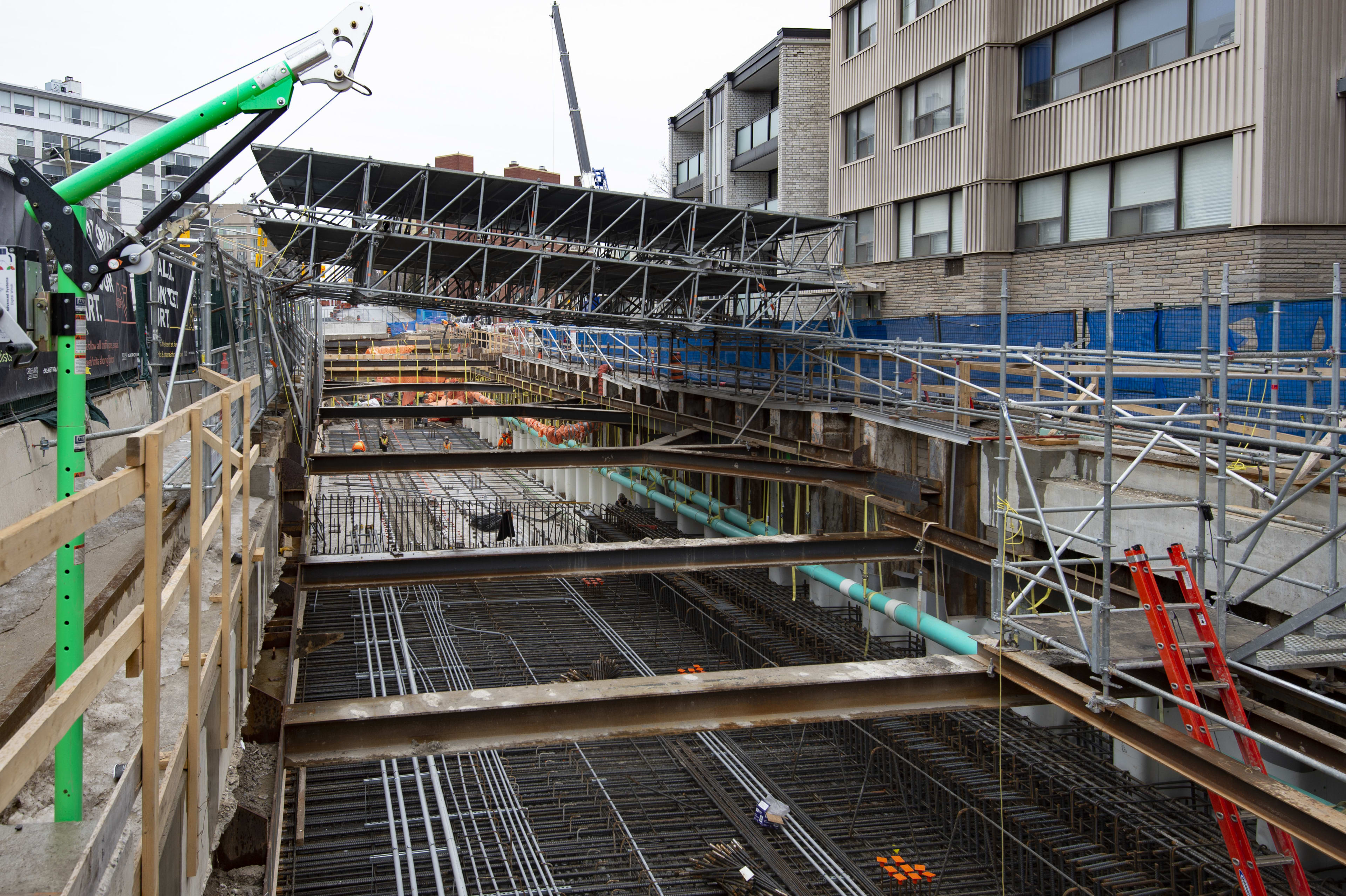 Metal supports and rebar line the subsection of construction work.