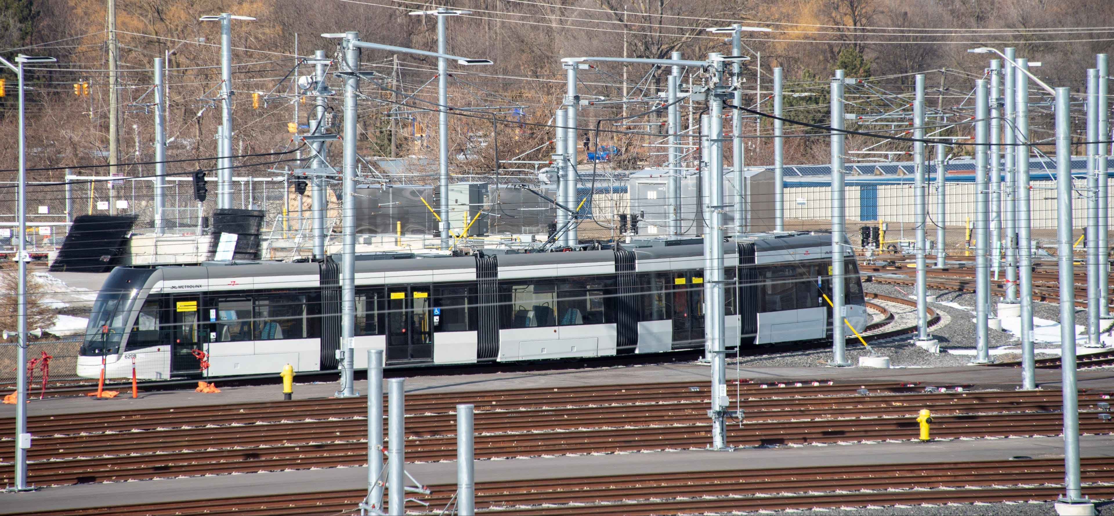 An LRV moves across tracks inside the facility.