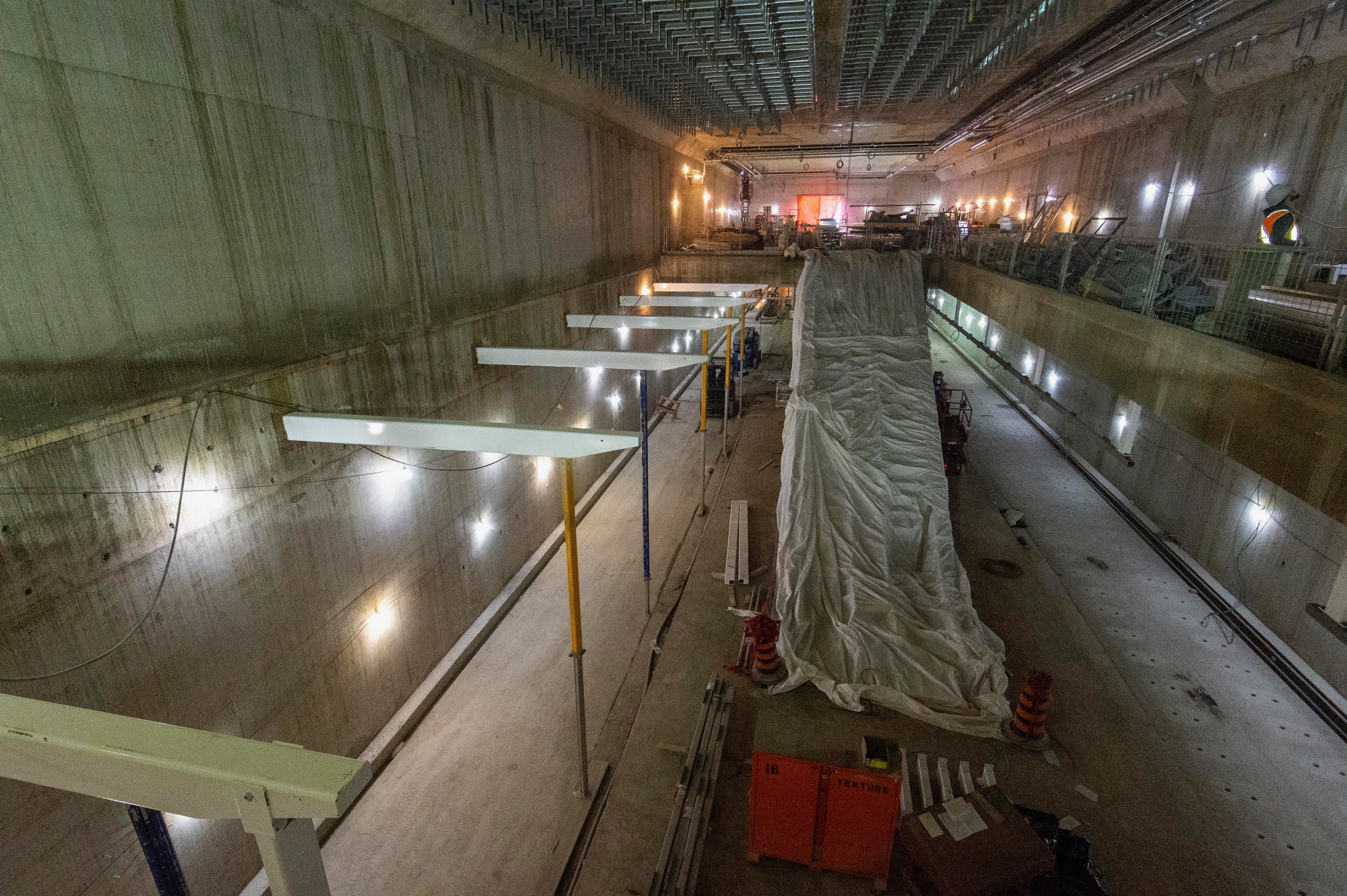 the inside of the Science Centre, with large concrete walls and building equipment.