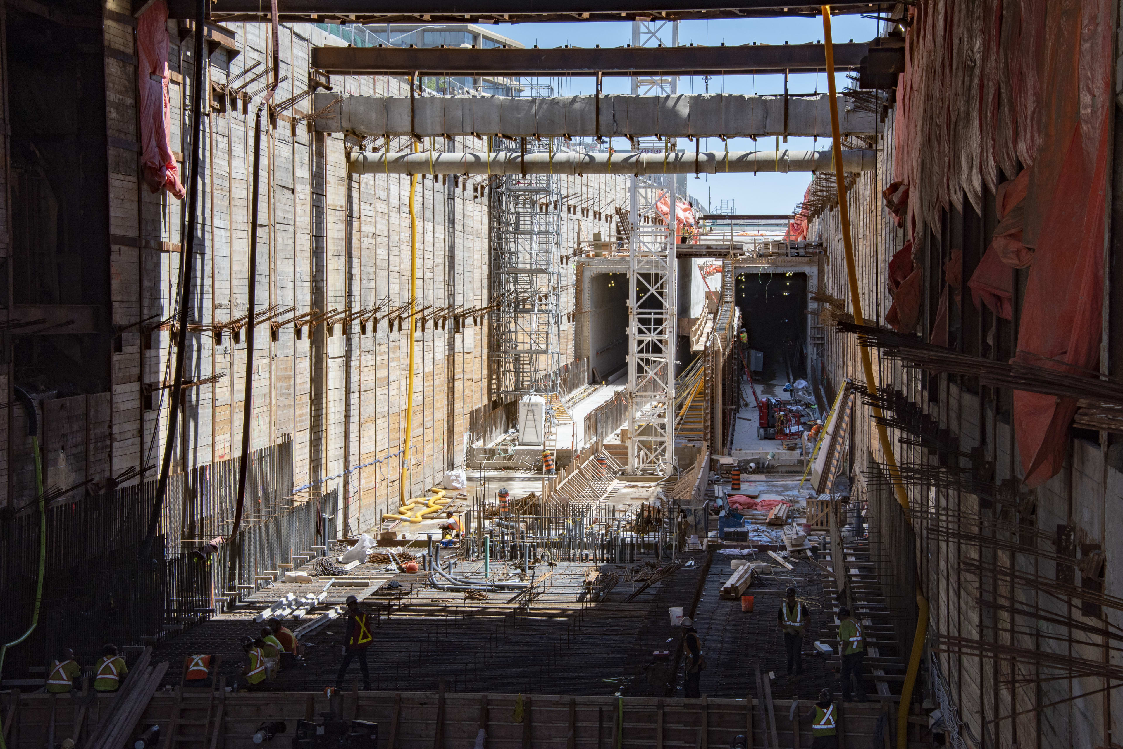 The construction site is shown with its many levels of wood and concrete and steel levels.