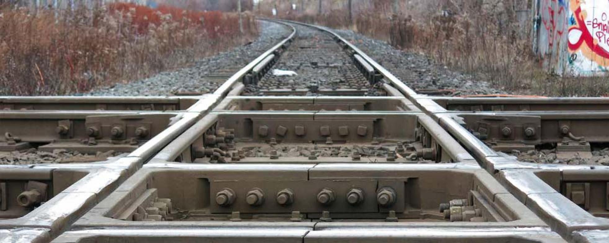 two rail tracks, crossing one another.