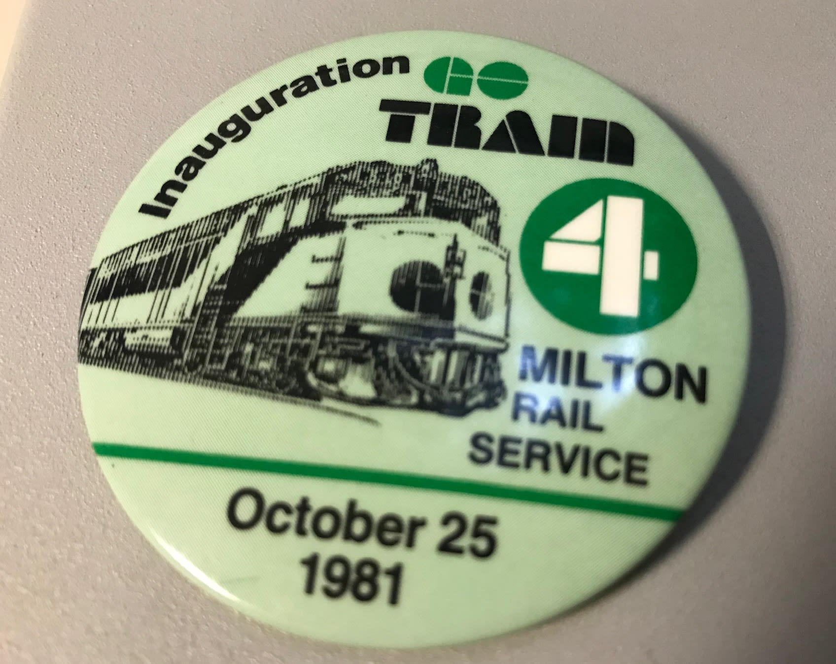 Photo shows a button that says "October 25, 1981 - Milton rail service'.