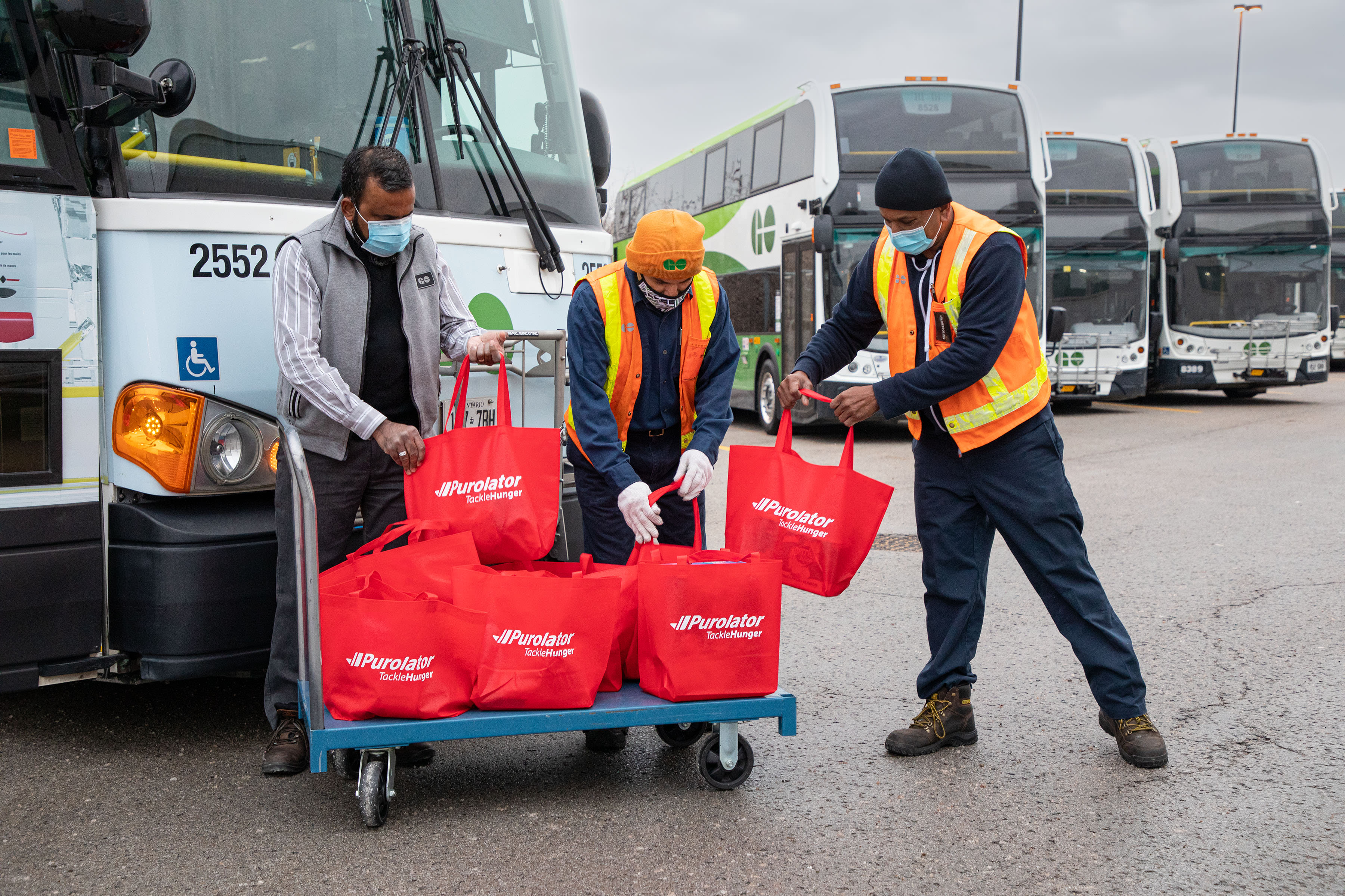 red bags could be seen loading into the special edition buses and Purolator Quick Stops throughou...