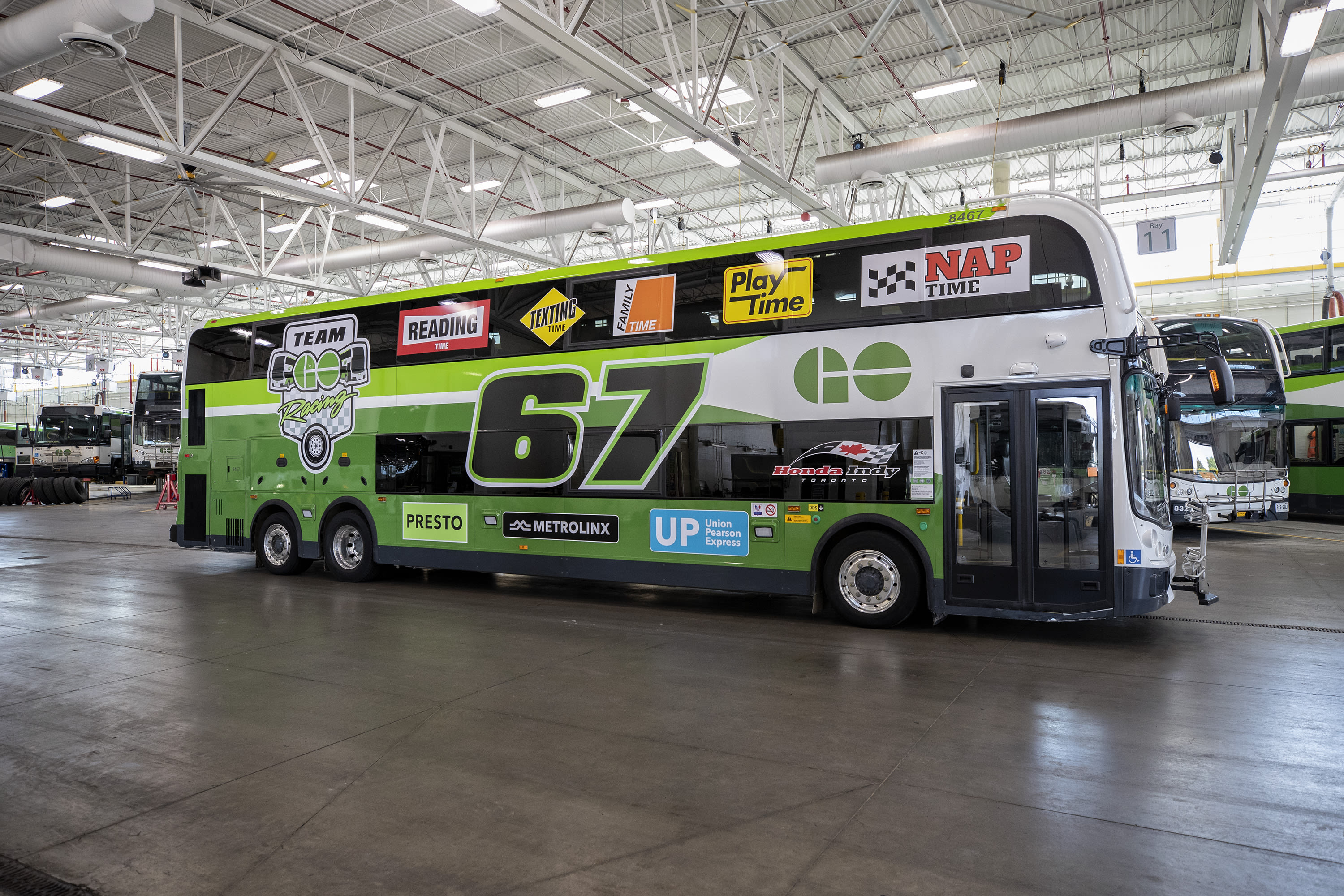 the double decker GO bus with Honda Indy decals