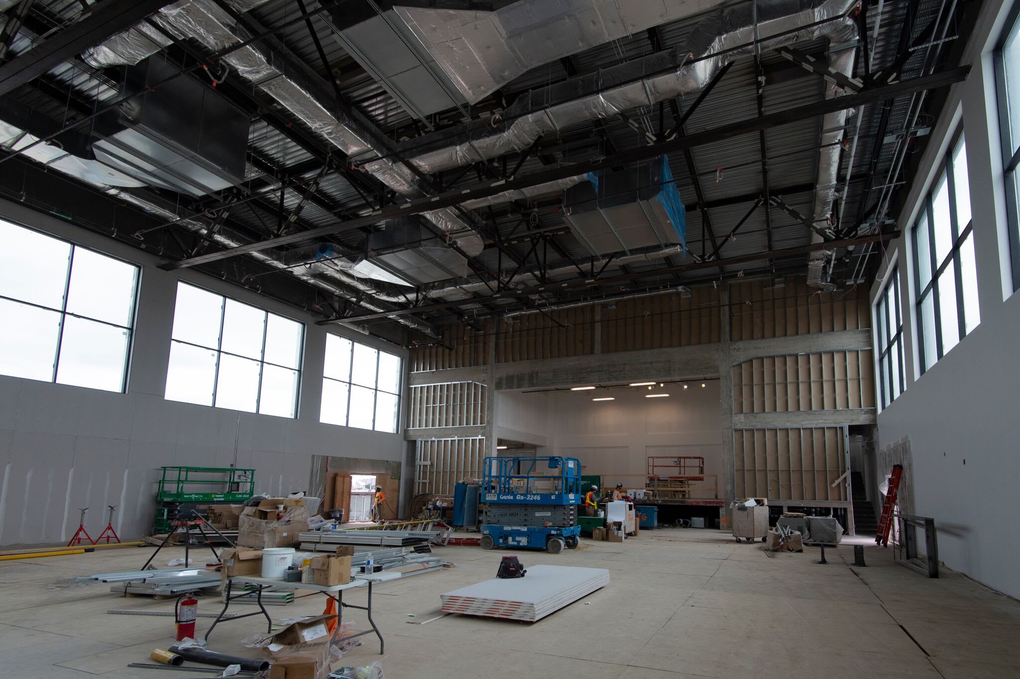 Inside the empty building, walls and ceiling are new and primed.
