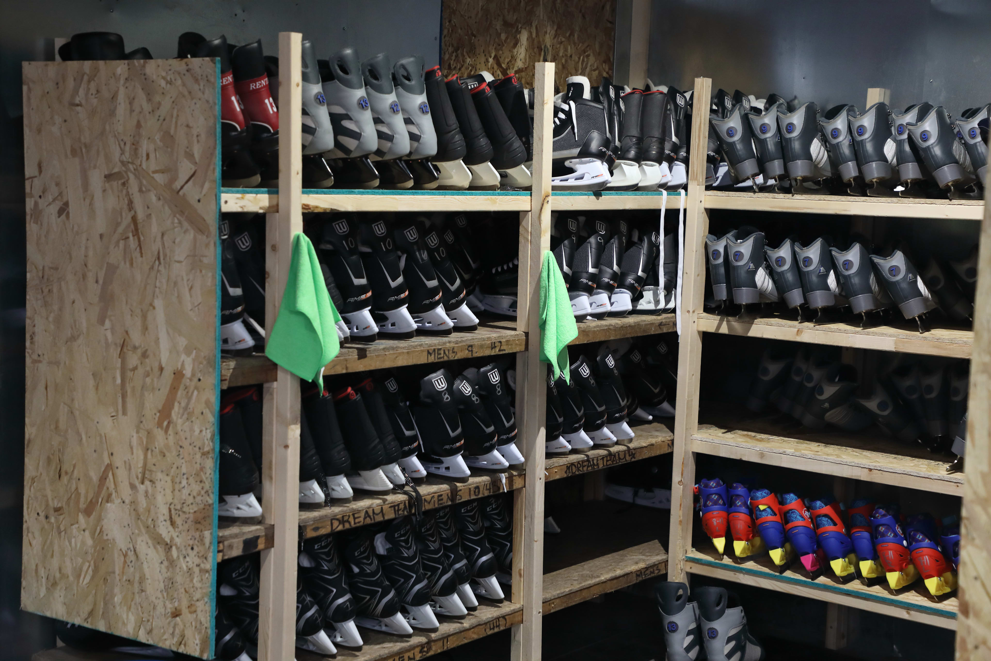 Ice skates on shelves, ready to be rented