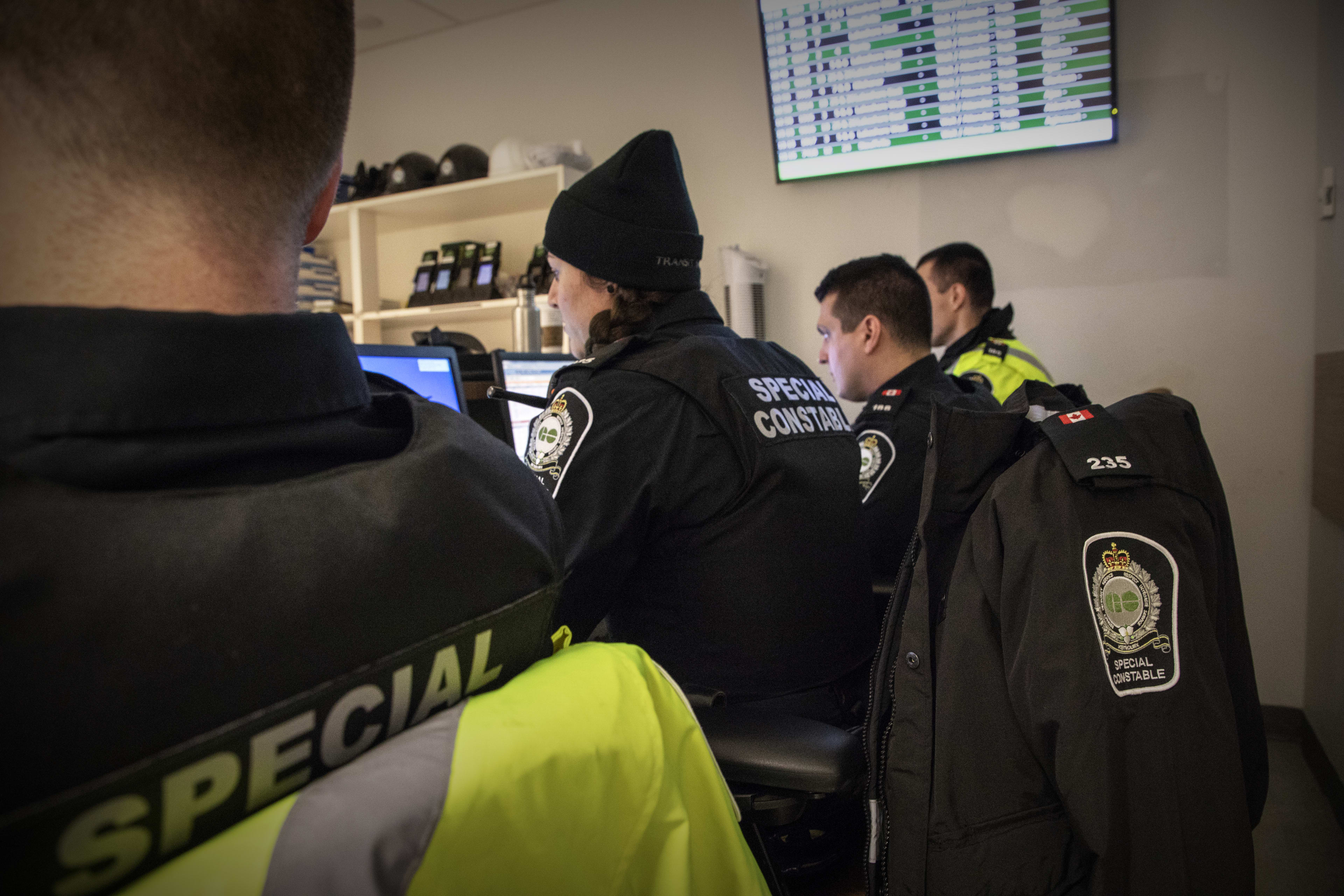 Officers gather in an office inside Union Station.