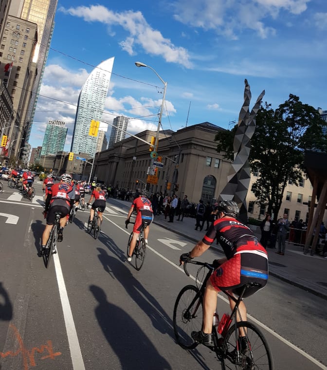 Officers ride their bikes in downtown Toronto.