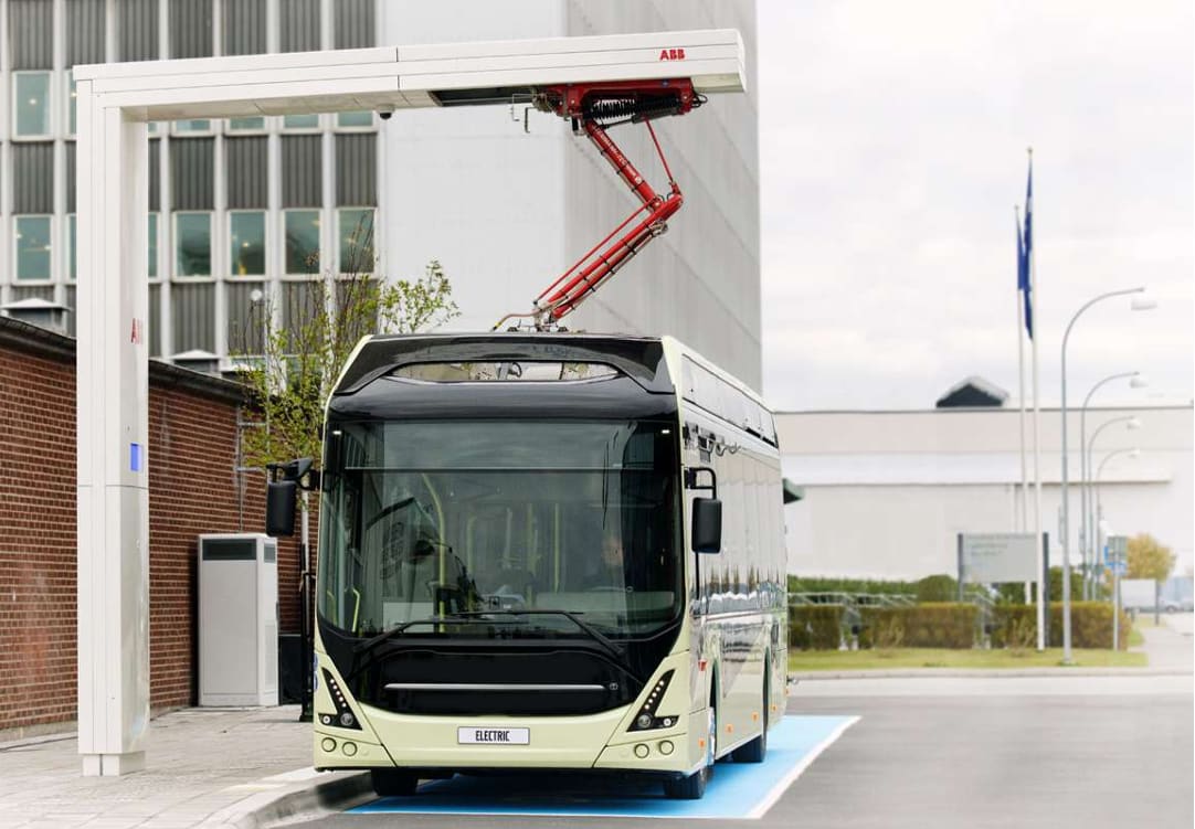 A bus being charged with a pantograph charging system