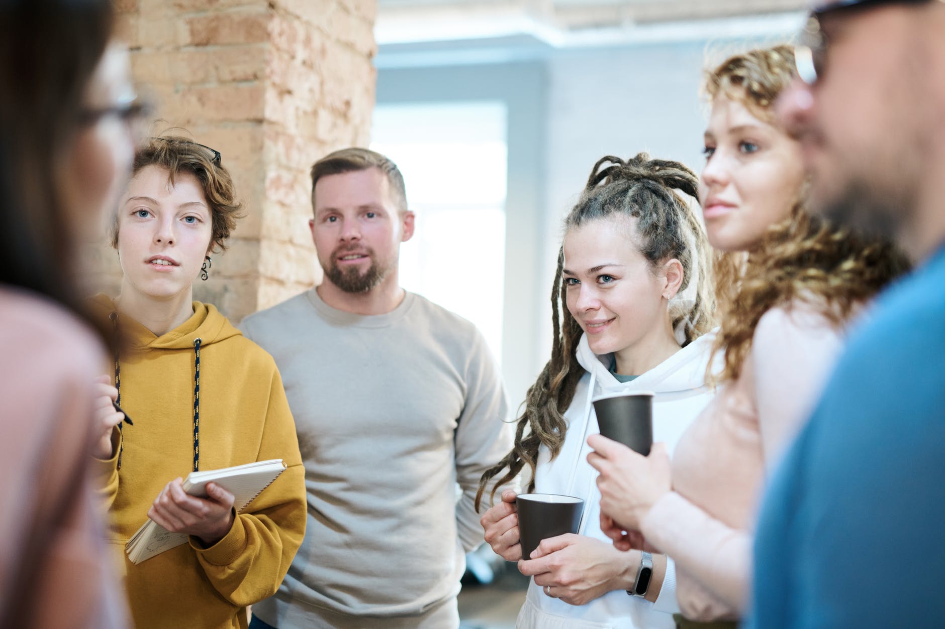 a group gathering around and talking.