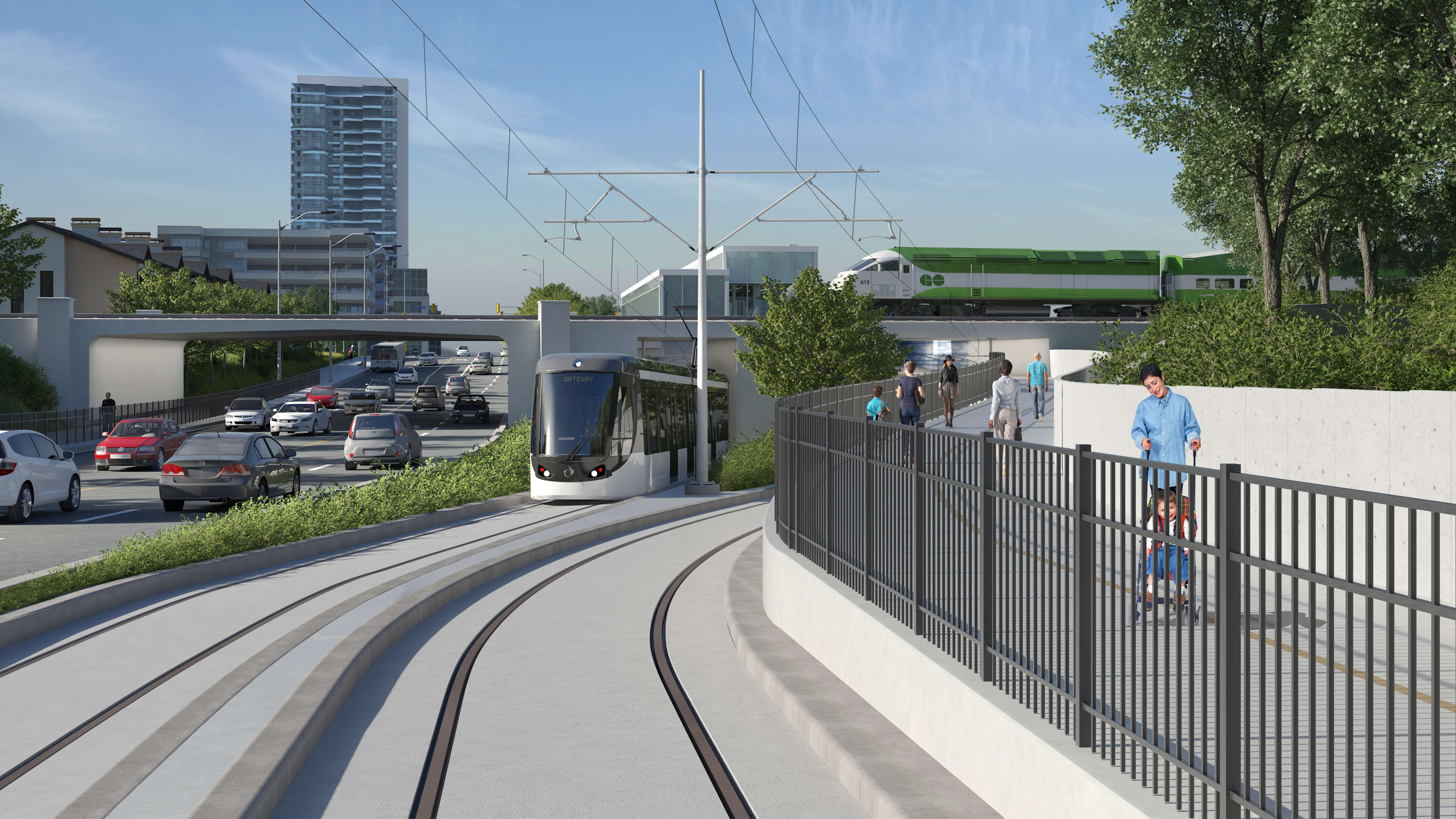 An LRT moves under a GO train.