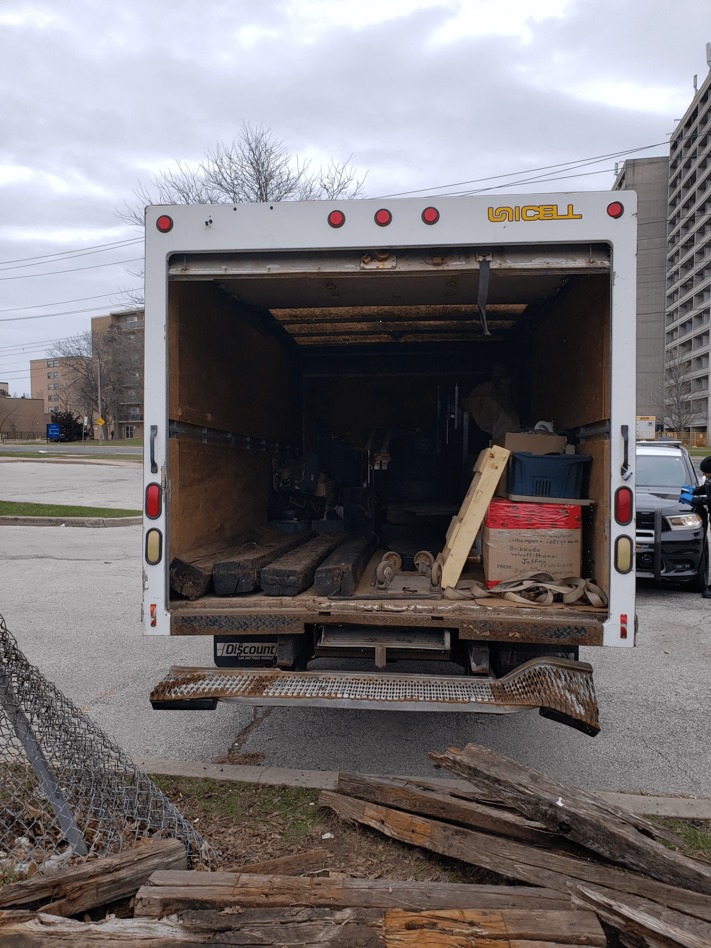 a cube van with rail ties inside.