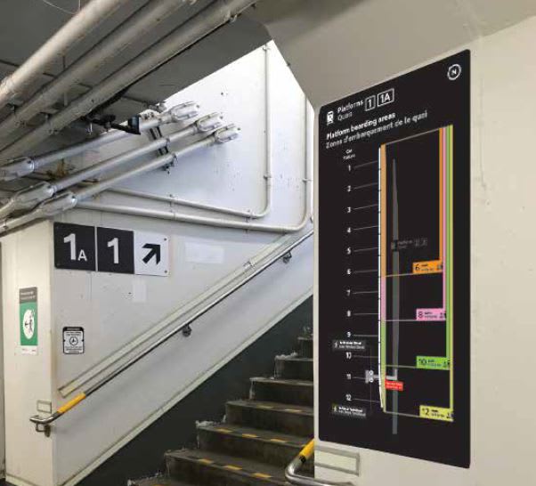 the new boarding sign in the tunnel below the platform