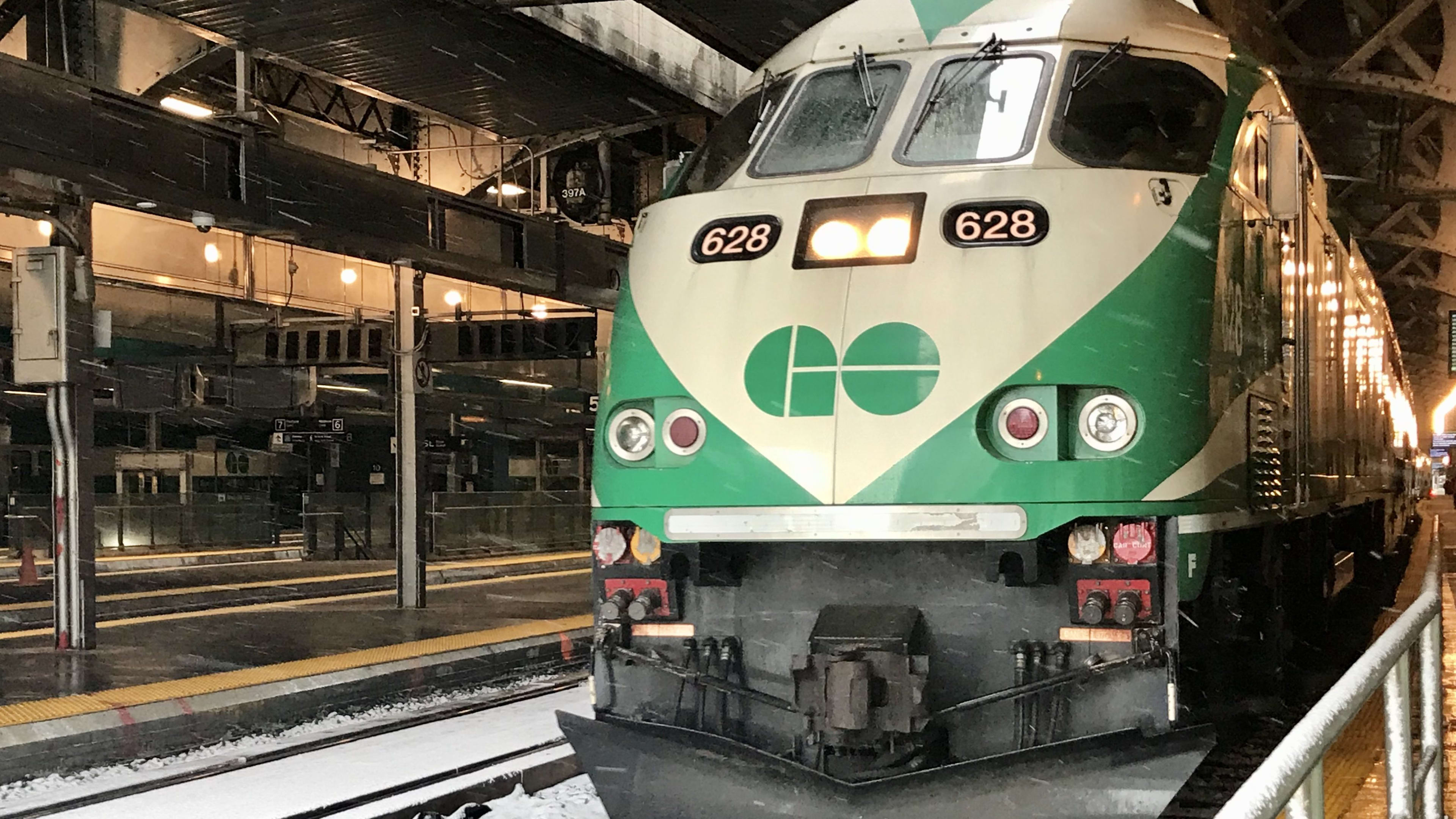 a GO train waits at a Union Station platform, before heading back out into the snow.