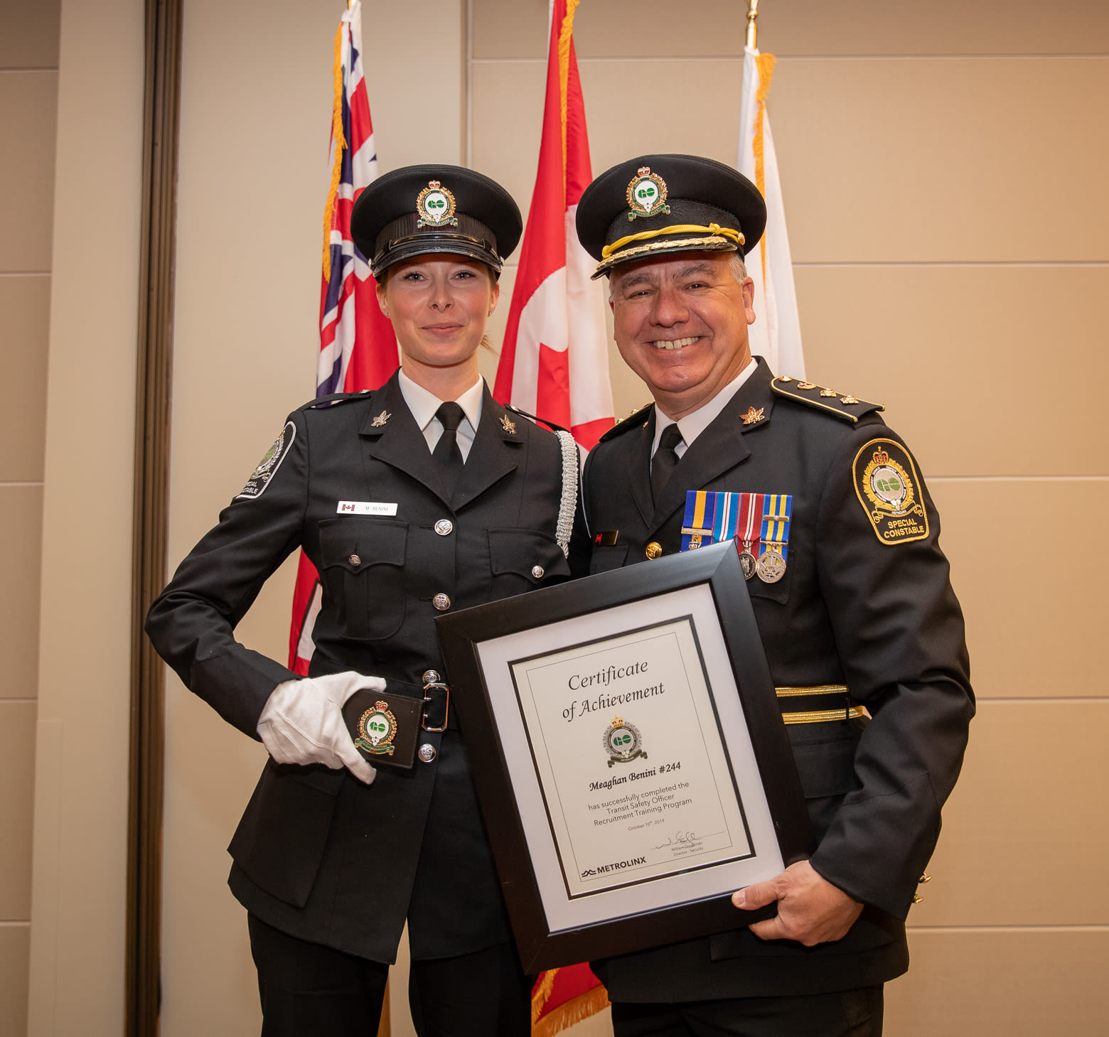 Meaghan Benini pictured with Transit Safety Director Bill Grodzinski at her graduation ceremony