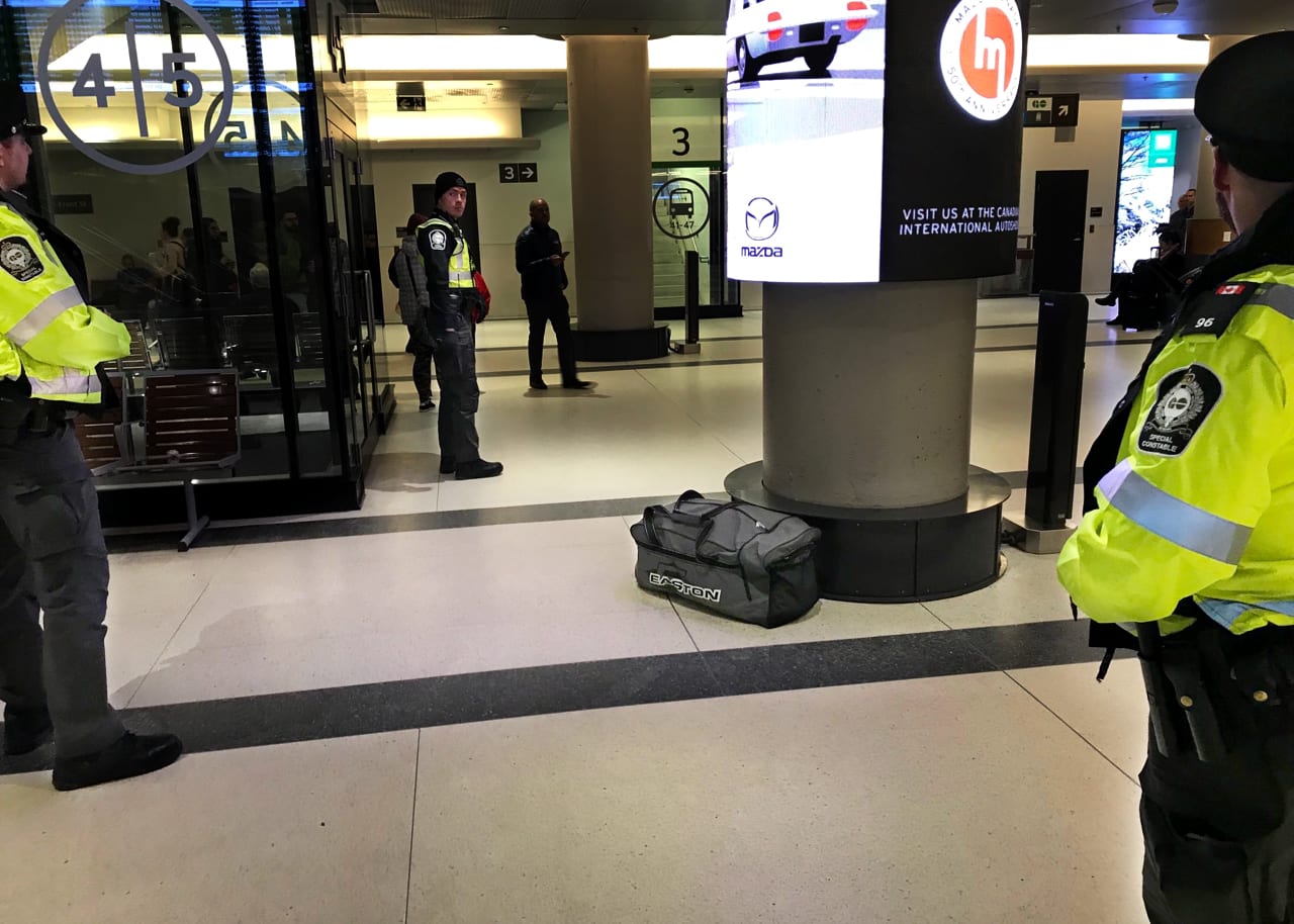 Transit officers stand near a suspicious bag inside Union Station.