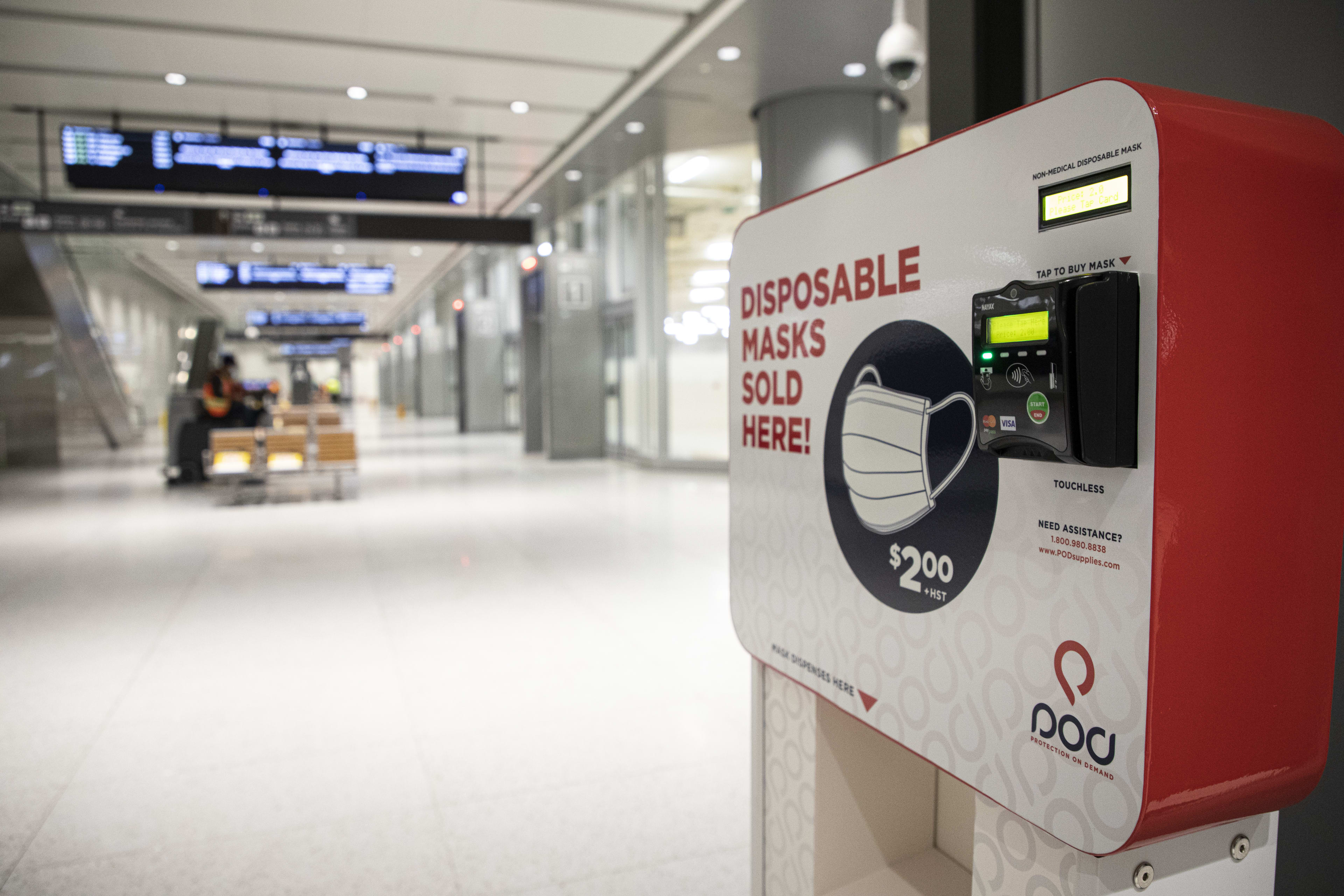 Image is of a machine selling face masks.