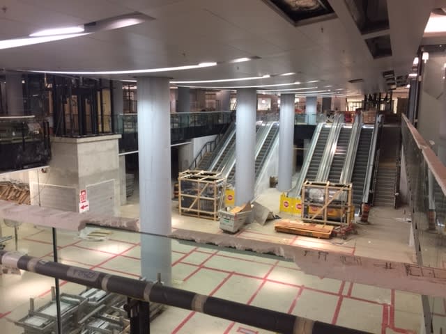 escalators installed, as the floor remains covered during construction.