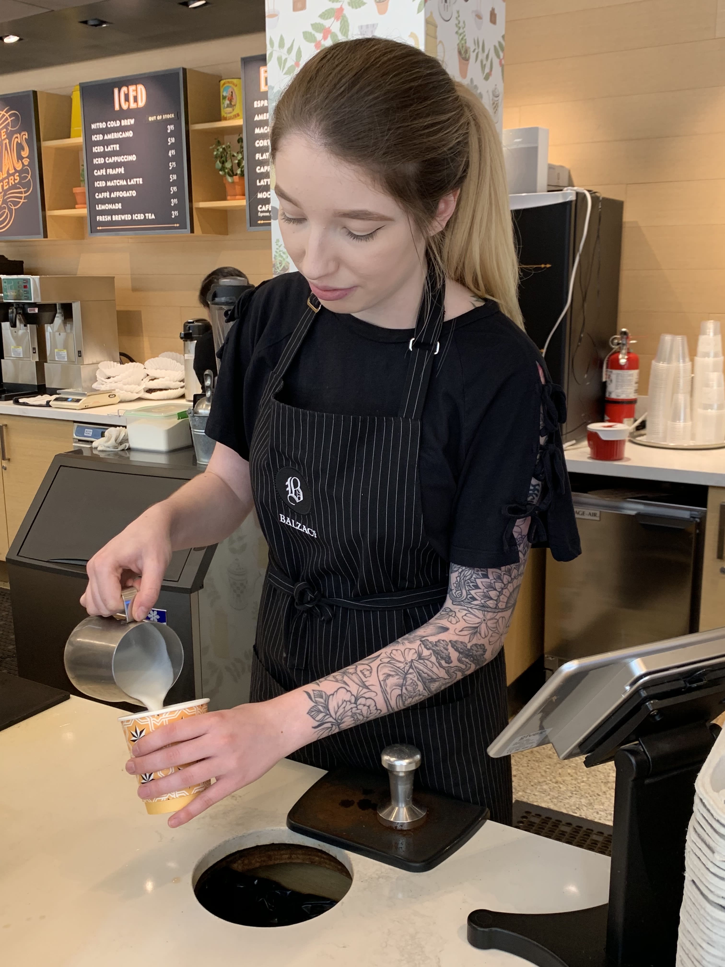Morgann Lomascolo pours a cup of coffee.