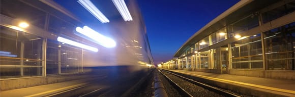 train blurred on tracks at night