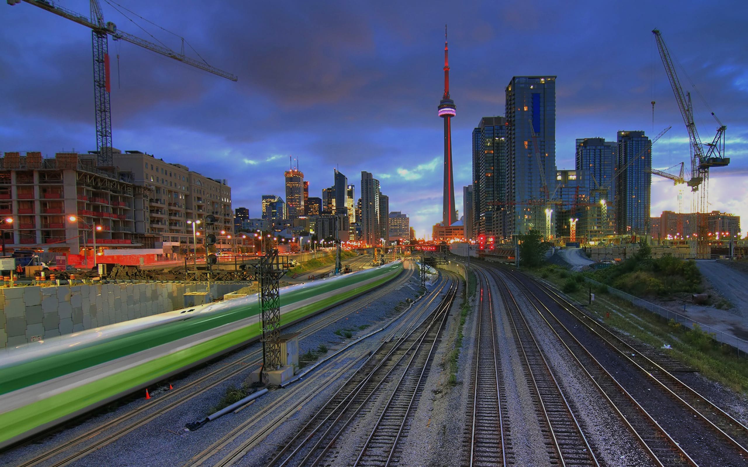 Metrolinx Go Train Downtown Toronto with CN Tower in the background light streaks