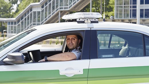 Transit Safety Officer sitting in his vehicle in the sun