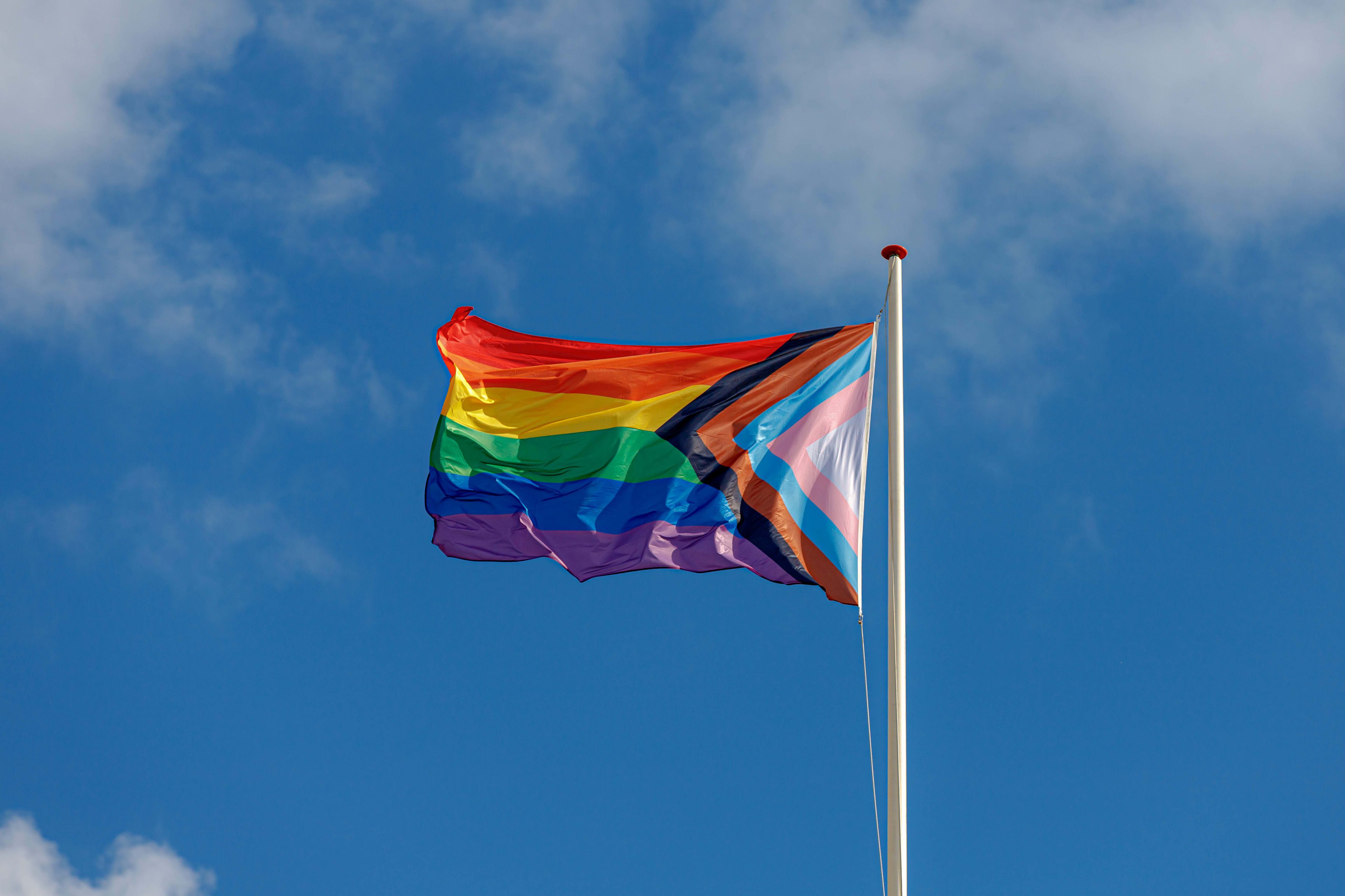 Progress Pride flag waving in the sky