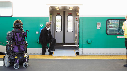 Person using wheelchair boarding GO train