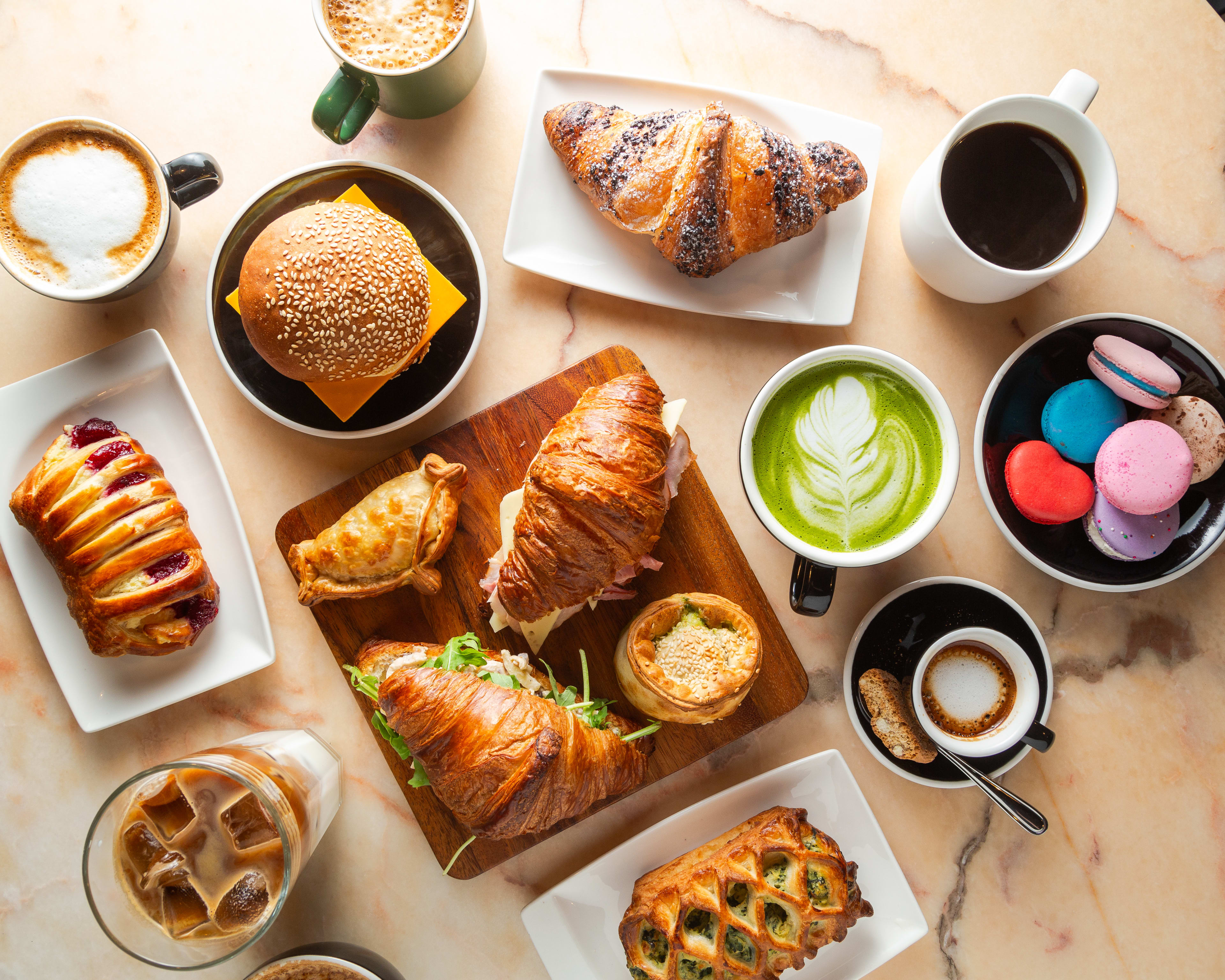 Table with a spread of pastries and drinks from Rosemount Cafe.