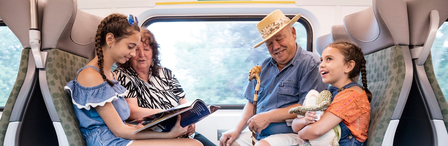 lifestyle photo, family on train, kids, hero banner