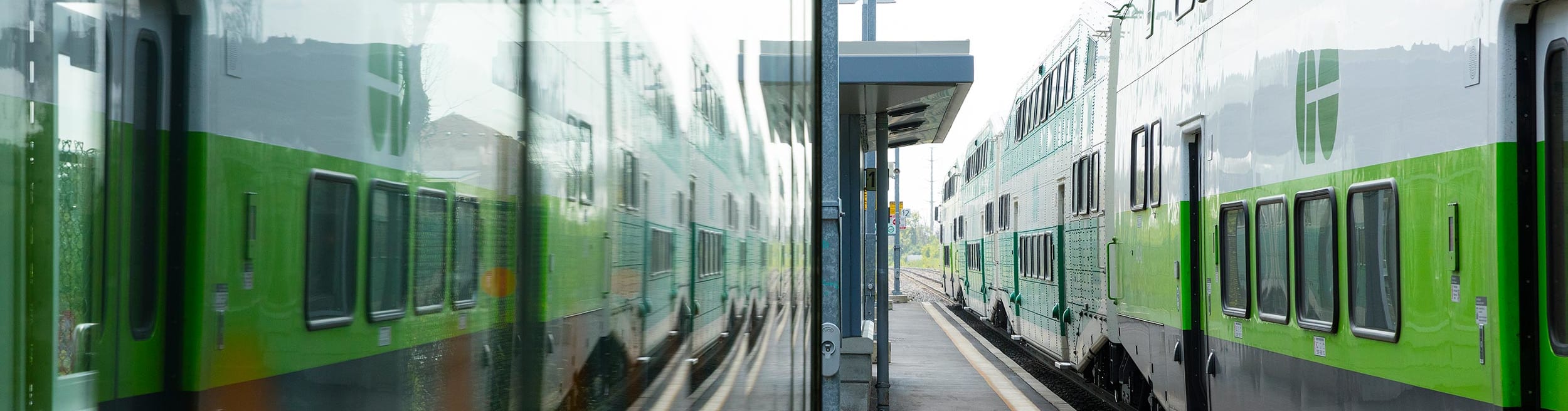 GO Train stopped stopped on an empty platform waiting for passengers