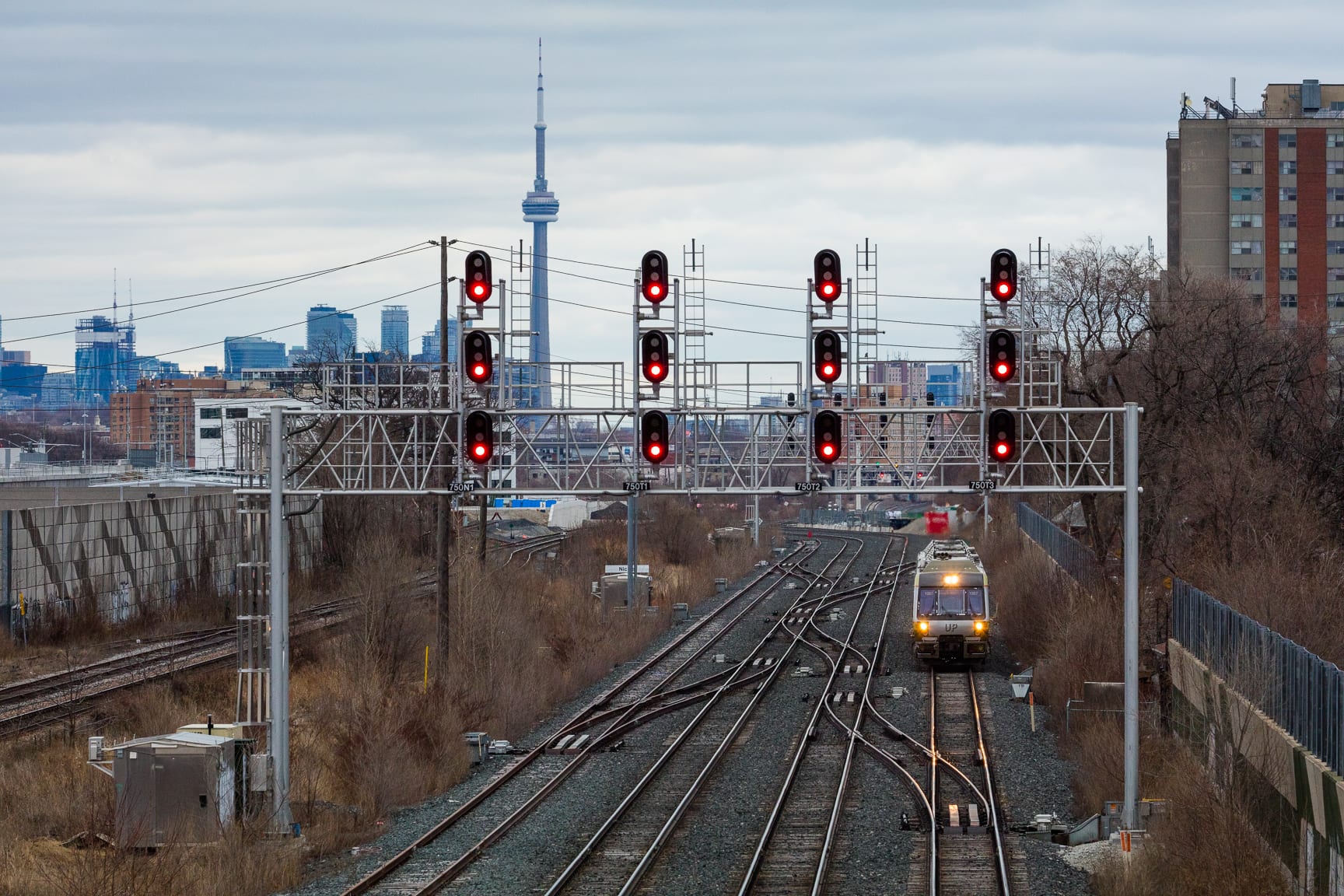 UP Train track with UP train approaching westbound with CN Tower in the background