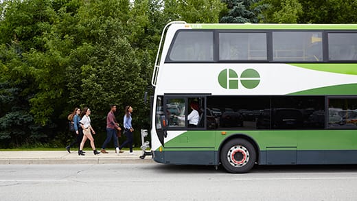 Students walking towards a GO bus