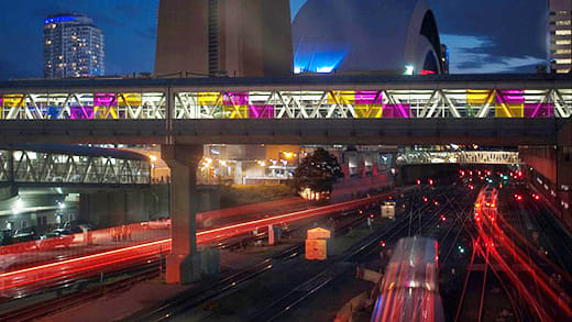 Union Station Skywalk at night with GO Train