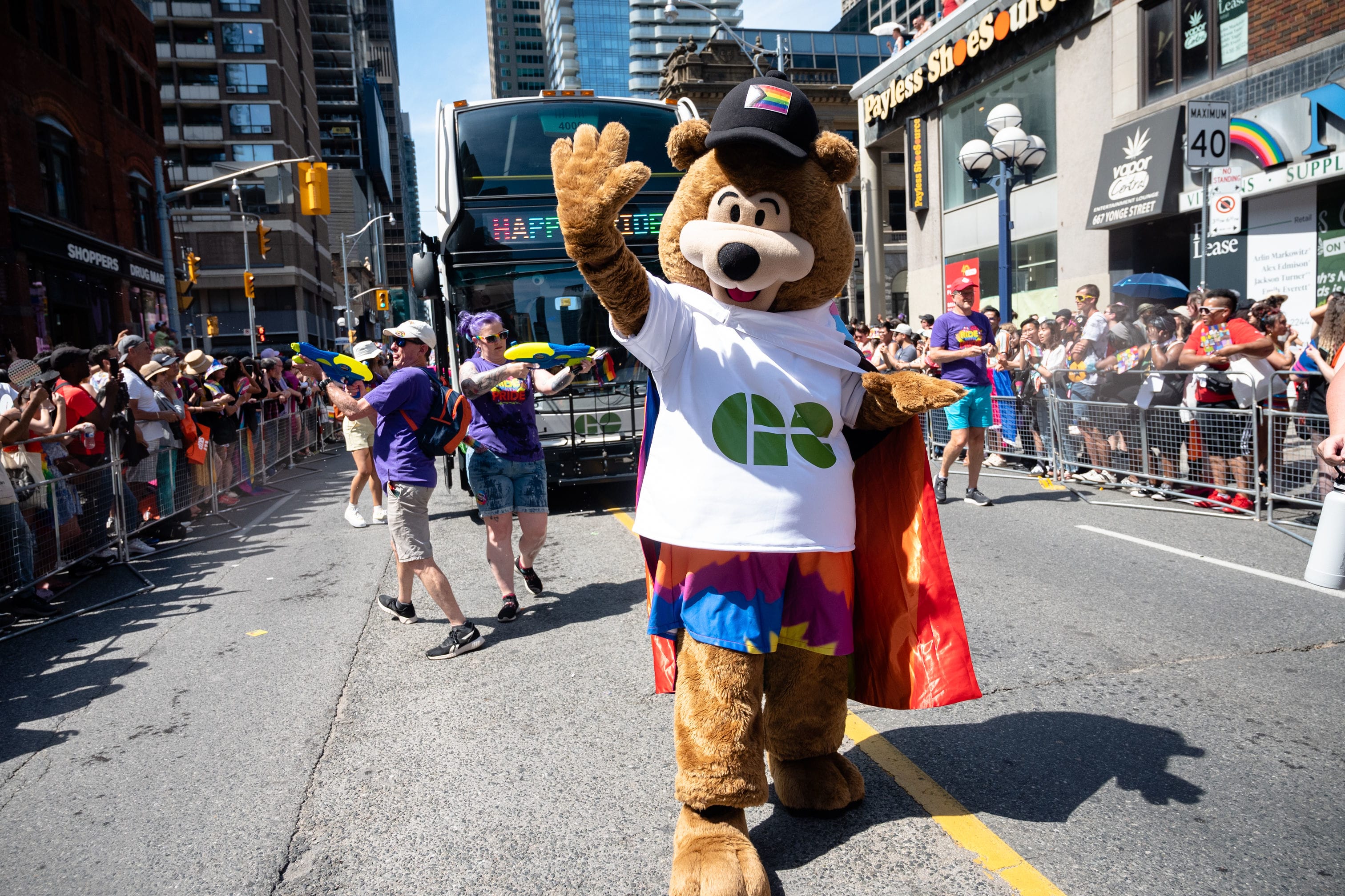 GO Bear waving to the camera at the Toronto Pride Parade