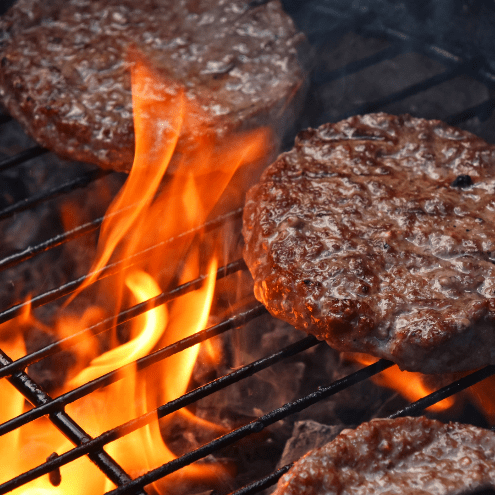 Burger patties on a hot grill