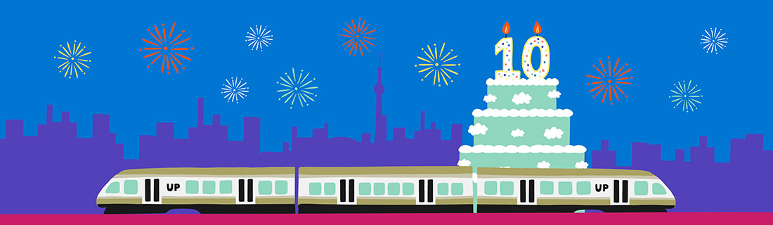 Colourful illustrated graphics depicting the UP Express train in front of a cake