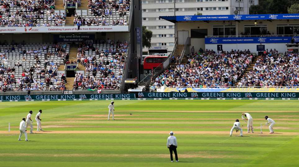 Cricket World Cup field during a test match with players in position.