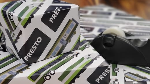 Wrapping paper featuring GO Transit vehicles, UP Express vehicles, and PRESTO cards