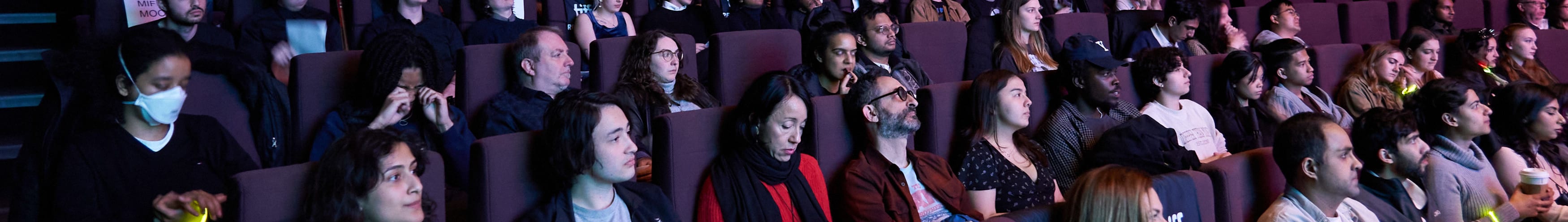 People watching a movie in the theatre