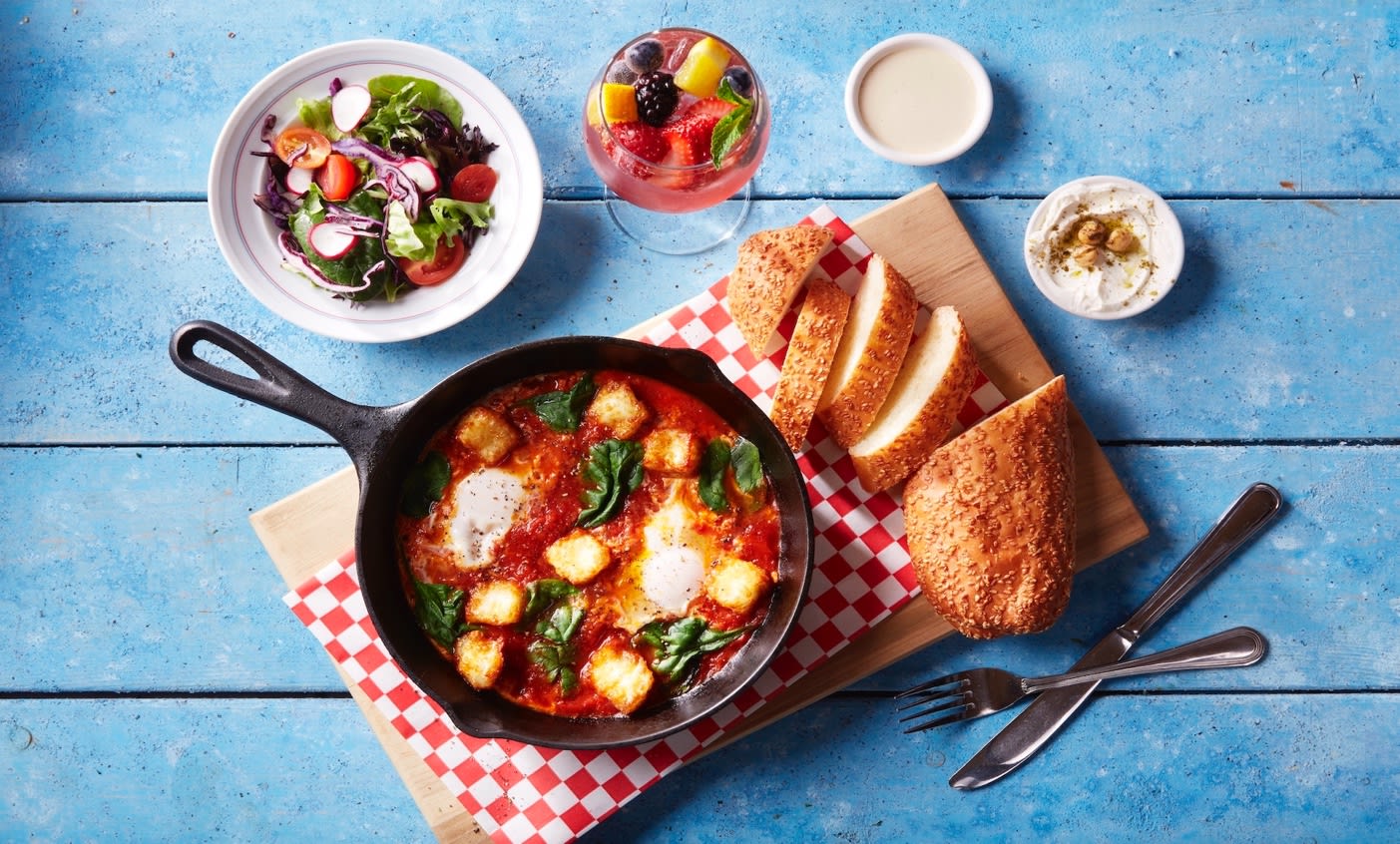 Breakfast spread including shakshouka, bread, salad and dips from Cafe Landwer.