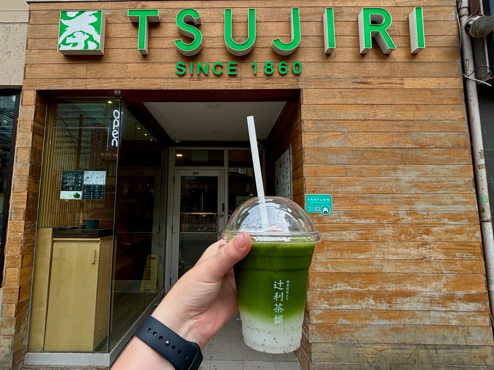 Tsujiri iced matcha latte outside Tsujiri storefront