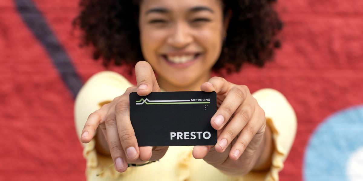 Woman holding PRESTO card