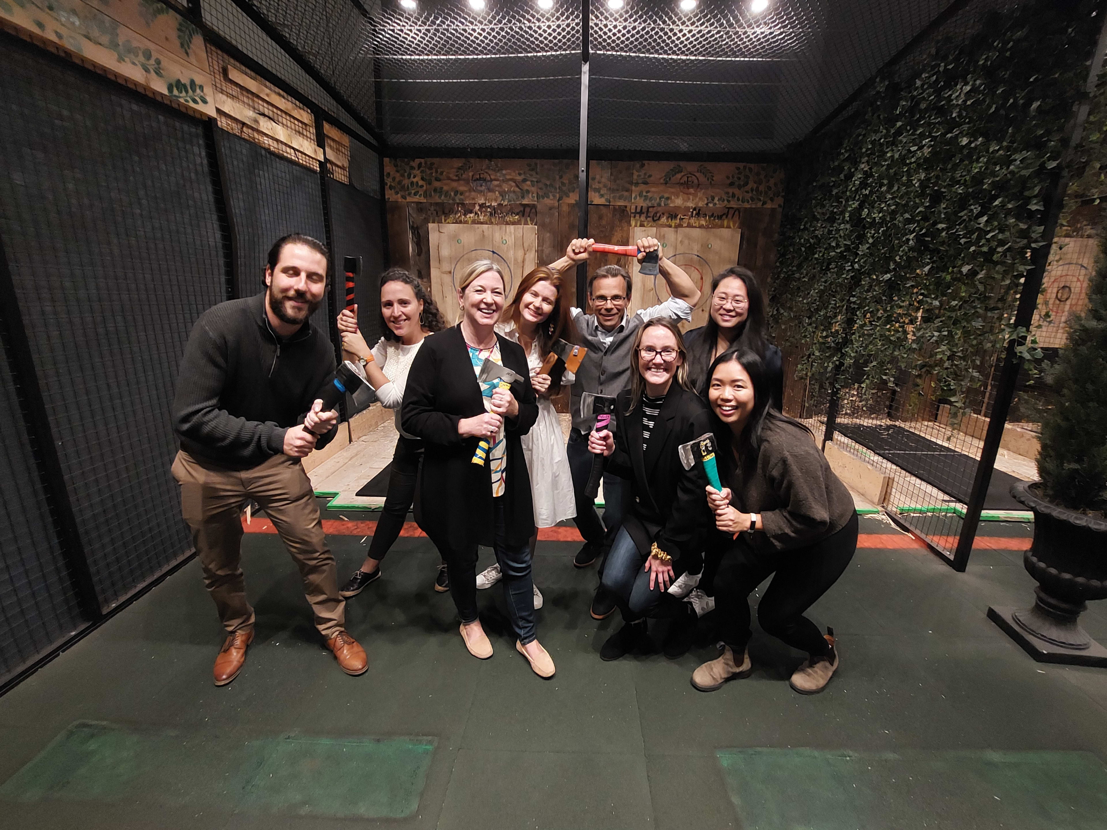 Group of friends at Escape Manor in Toronto, enjoying axe throwing