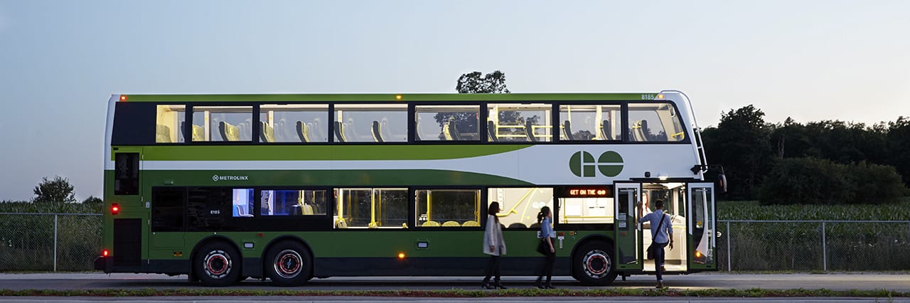 A bus picks up passengers.