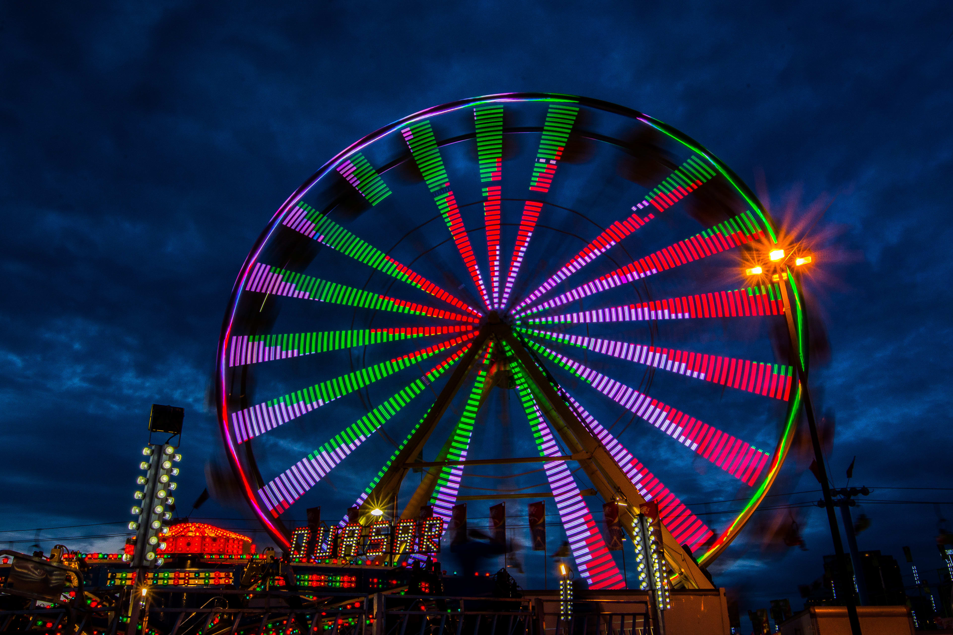 Ferris wheel lit up at night at the CNE (Canadian National Exhibition) in Toronto.