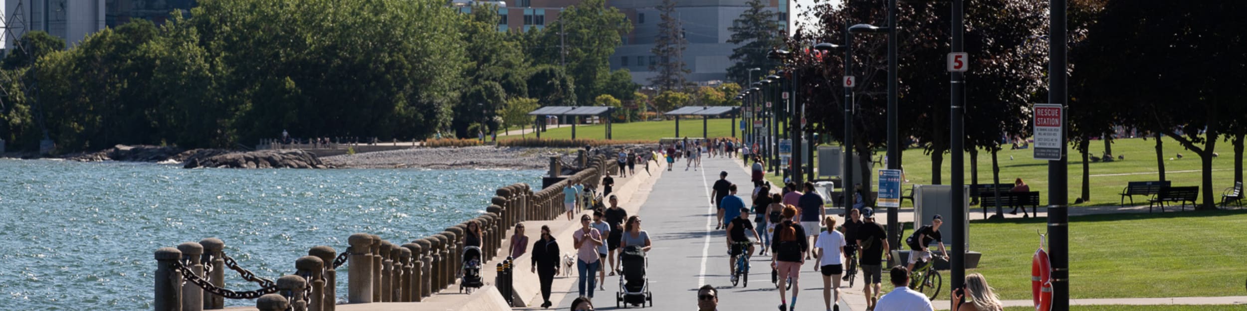 People walking down the path by Burlington Waterfront