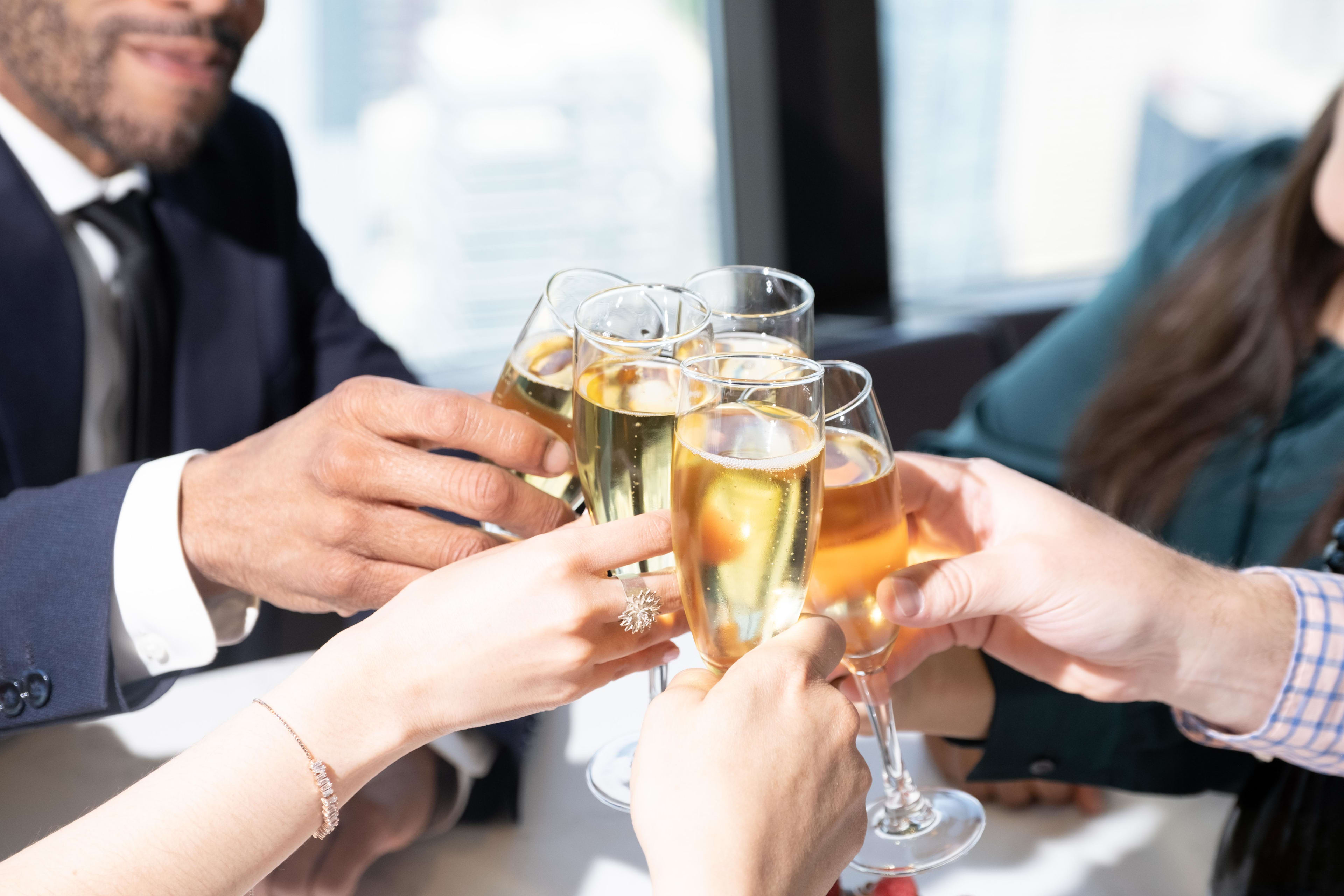 Group of people clinking glasses at 360 The Restaurant at the CN Tower