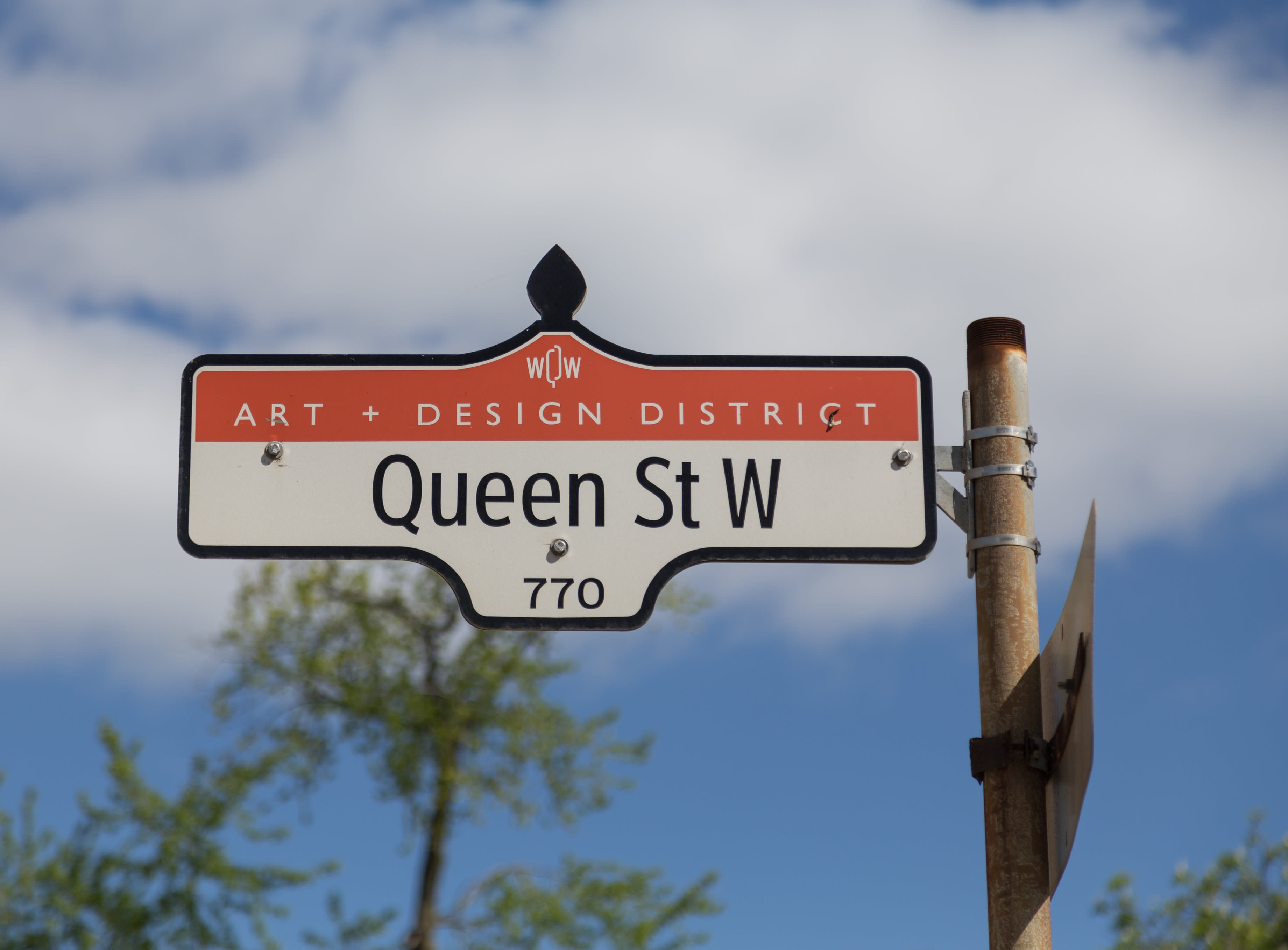 Street sign of Queen Street West in Toronto